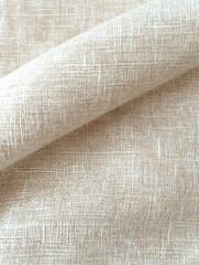 Close-up of textured beige woven fabric with natural fibers and visible crosshatch pattern