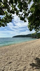 Serene Tropical Beach Tranquil Ocean, Pebbled Shore, Lush Greenery