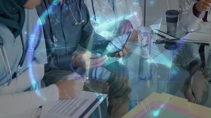 Male doctor tapping tablet showing holographic medical network lines while colleagues noting forms - Powered by Adobe