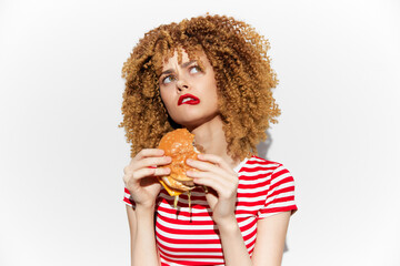 Young models enjoying a delicious burger, showcasing healthy eating with vibrant colors and joyful...