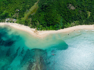 Clear turquoise sea water and waves in Nacpan Beach. El Nido, Palawan. Philippines.