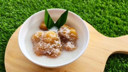 Candil porridge is made from sticky rice flour, brown sugar and coconut milk, shaped like balls or...
