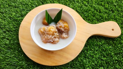 Candil porridge is made from sticky rice flour, brown sugar and coconut milk, shaped like balls or...
