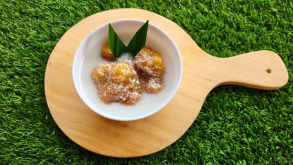 Candil porridge is made from sticky rice flour, brown sugar and coconut milk, shaped like balls or...
