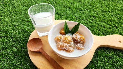 Candil porridge is made from sticky rice flour, brown sugar and coconut milk, shaped like balls or...