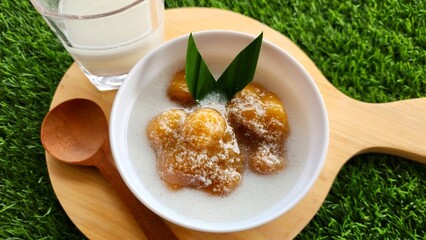 Candil porridge is made from sticky rice flour, brown sugar and coconut milk, shaped like balls or...