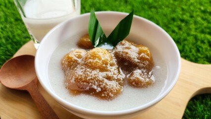 Candil porridge is made from sticky rice flour, brown sugar and coconut milk, shaped like balls or...
