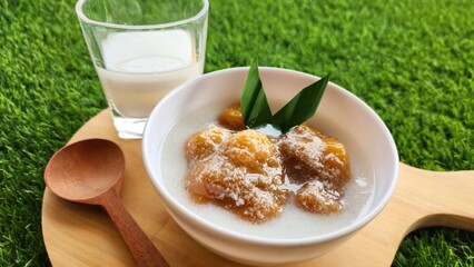 Candil porridge is made from sticky rice flour, brown sugar and coconut milk, shaped like balls or...
