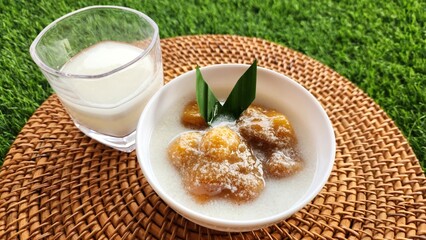 Candil porridge is made from sticky rice flour, brown sugar and coconut milk, shaped like balls or...