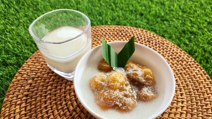 Candil porridge is made from sticky rice flour, brown sugar and coconut milk, shaped like balls or...