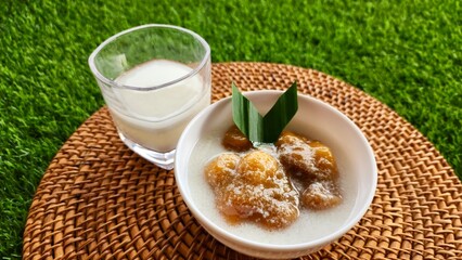 Candil porridge is made from sticky rice flour, brown sugar and coconut milk, shaped like balls or...