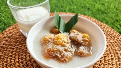 Candil porridge is made from sticky rice flour, brown sugar and coconut milk, shaped like balls or...