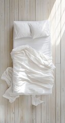 Empty white bed on light wood floor