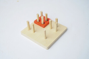 Montessori wooden toy with vertical pegs
