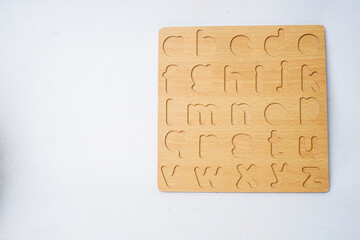 Wooden alphabet toy for kids isolated white background