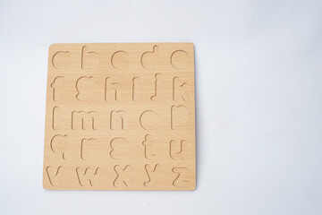 Wooden alphabet toy for kids isolated white background