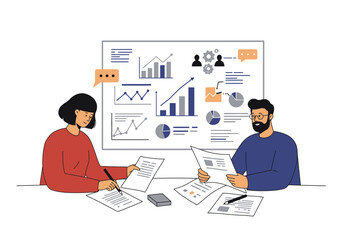 Two people review charts and documents at a desk