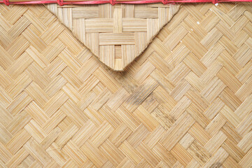 Woven bamboo fan envelope with red string