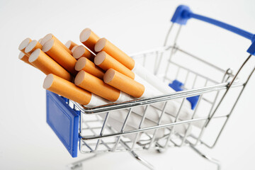 Cigarette in shopping cart, cost, trading, marketing and production, No smoking concept.