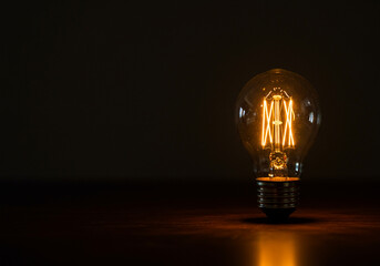 Glowing Lightbulb Idea on Dark Background Representing Innovation and Creativity