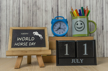 World Horse Day 11th July Concept With Alarm Clock and Chalkboard