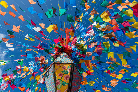 Colorful flags and decorative balloons for the S&atilde;o Jo&atilde;o festival, with blue skies, which takes place in June in the northeast of Brazil.