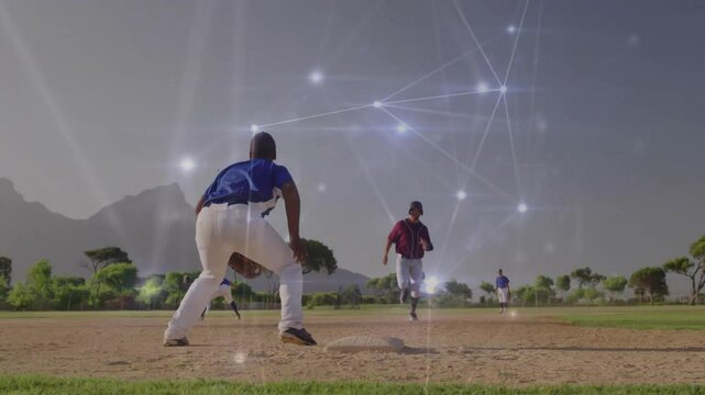 Baseball third baseman bracing as baserunner bursting, sliding into base with network showing tag
