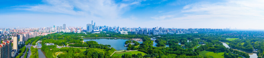 Obraz premium Panoramic Aerial view of Shanghai Century Park and apartment buildings on sunny day