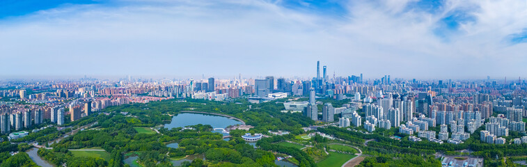 Obraz premium Panoramic Aerial view of Shanghai Century Park and apartment buildings on sunny day