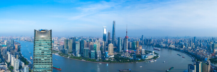 Panoramic Aerial view of Shanghai skyline and winding river on sunny day.