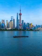 Aerial view of Shanghai skyscrapers in Pudong new area and  Huangpu river at dusk.