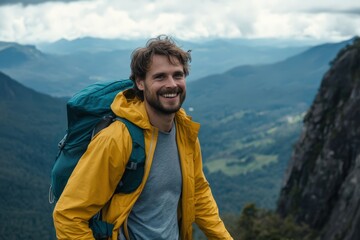 Naklejka premium Smiling hiker with a backpack on a mountaintop.
