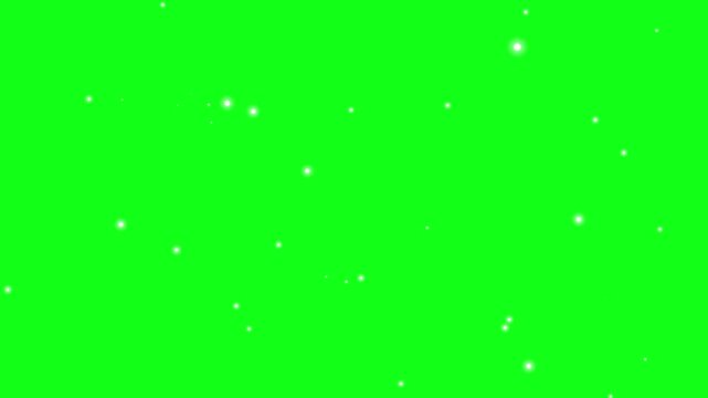 dust particles floating on green background. fireflies magic sparkles floating particles, dust particles isolated on green background. Flying dust particles on a green background.