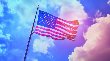 United states flag. The United States flag waves proudly on a flagpole against a bright blue sky