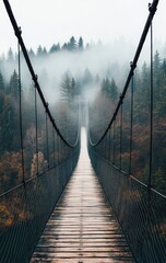 Misty suspension bridge through a forest