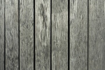Rustic wooden fence surface with textured vertical planks