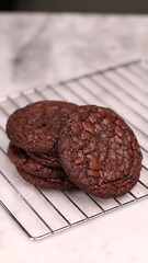 Fudgy Brownie Cookies combine the rich, chewy center of a brownie with the crisp edges of a cookie. With glossy, crackly tops and deep chocolate flavor, these cookies offer melt-in-your-mouth indulgen