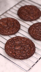Fudgy Brownie Cookies combine the rich, chewy center of a brownie with the crisp edges of a cookie. With glossy, crackly tops and deep chocolate flavor, these cookies offer melt-in-your-mouth indulgen