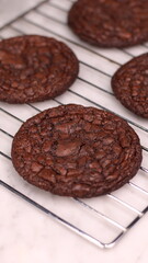 Fudgy Brownie Cookies combine the rich, chewy center of a brownie with the crisp edges of a cookie. With glossy, crackly tops and deep chocolate flavor, these cookies offer melt-in-your-mouth indulgen