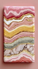 Colorful abstract wall art featuring pink, gold, and earthy tones on a textured canvas in a modern setting