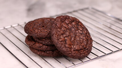 Fudgy Brownie Cookies combine the rich, chewy center of a brownie with the crisp edges of a cookie. With glossy, crackly tops and deep chocolate flavor, these cookies offer melt-in-your-mouth indulgen