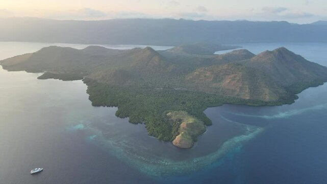 Dawn sheds soft light on the island of Lembata in the Lesser Sunda Islands, not far from Alor. This tropical area harbors many marine habitats and thus supports spectacular marine biodiversity.