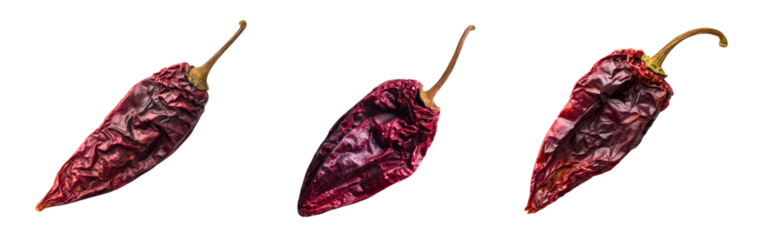 Set of spicy dried red chili peppers with deep shadows and wrinkled surface isolated on a white or transparent background
