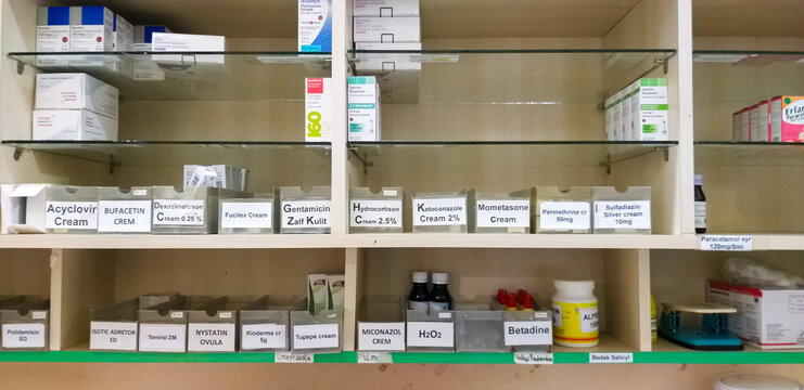 Various Medicines Neatly Arranged on Pharmacy Shelf at Hospital in Indonesia