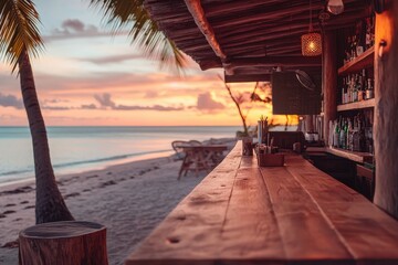 Wooden beach bar at sunset over the ocean.