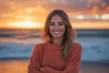 Woman smiling warmly at the beach sunset.