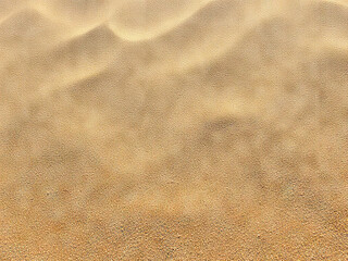 Golden sand texture with soft ripples, evoking serene desert or beach atmosphere