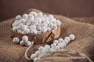 Chickpea Snacks Topped with Creamy White Sauce - Close-up of Oriental Sugar Coated Sweets with Chickpea Filling