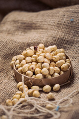 Hazelnuts and Almonds in Paper Containers on White Background – Isolated Nuts