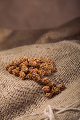 Marinated Nuts with Brown Sauce and Sesame on White Background– Rustic Gourmet Snack